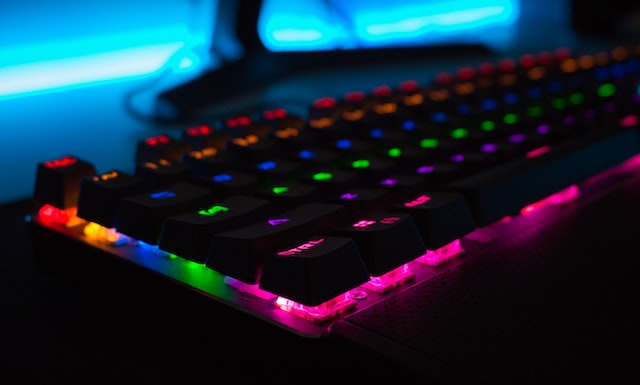 Close up the bottom left corner of an RGB PC gaming peripheral - a mechanical keyboard