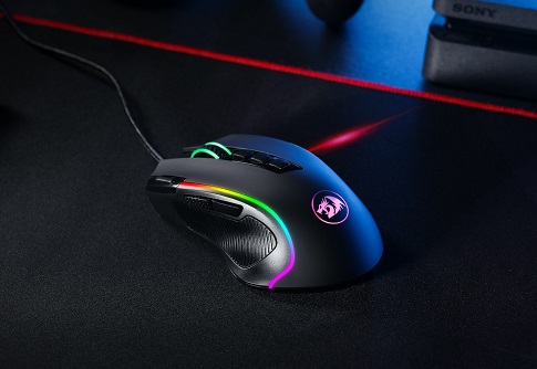 A black and RGB gaming mouse sitting on a mouse pad