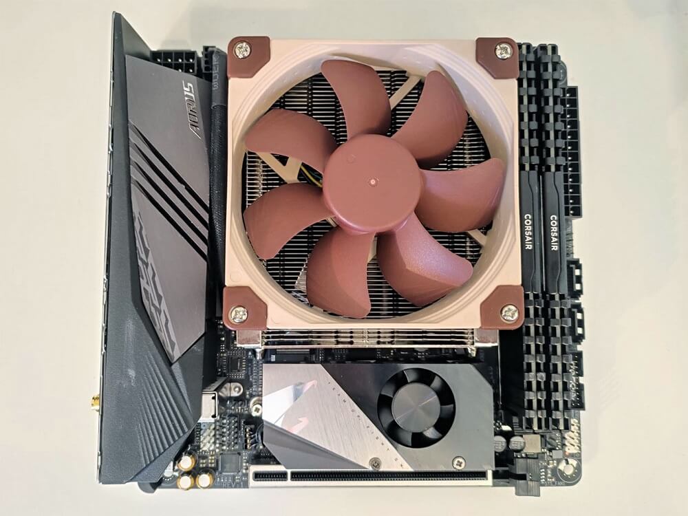 X570 I Aorus Wifi Motherboard with RAM sticks and a CPU with its cooling fan installed
