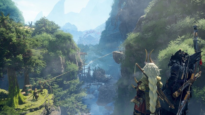 Gameplay image from Wild Hearts showing two characters looking down at a mountain valley environment