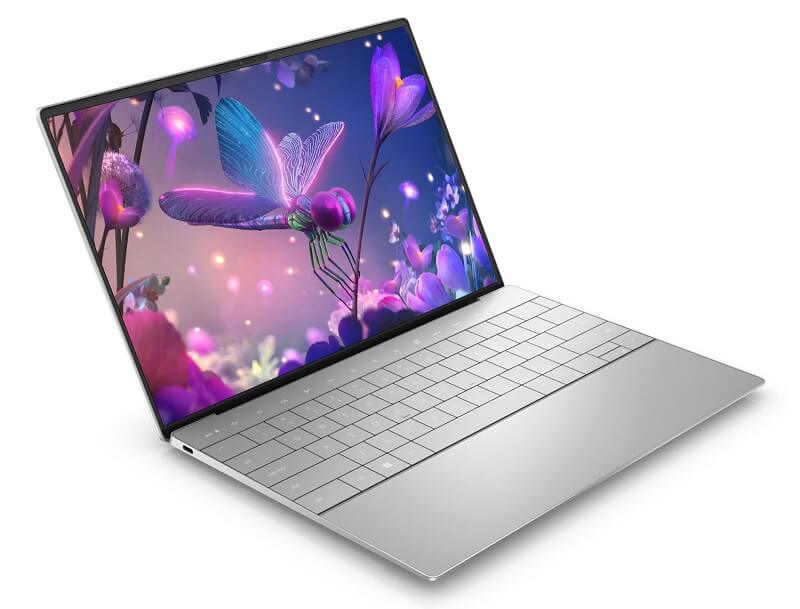 An open laptop with a futuristic image on the screen of a neon dragonfly surrounded by bright purple flowers