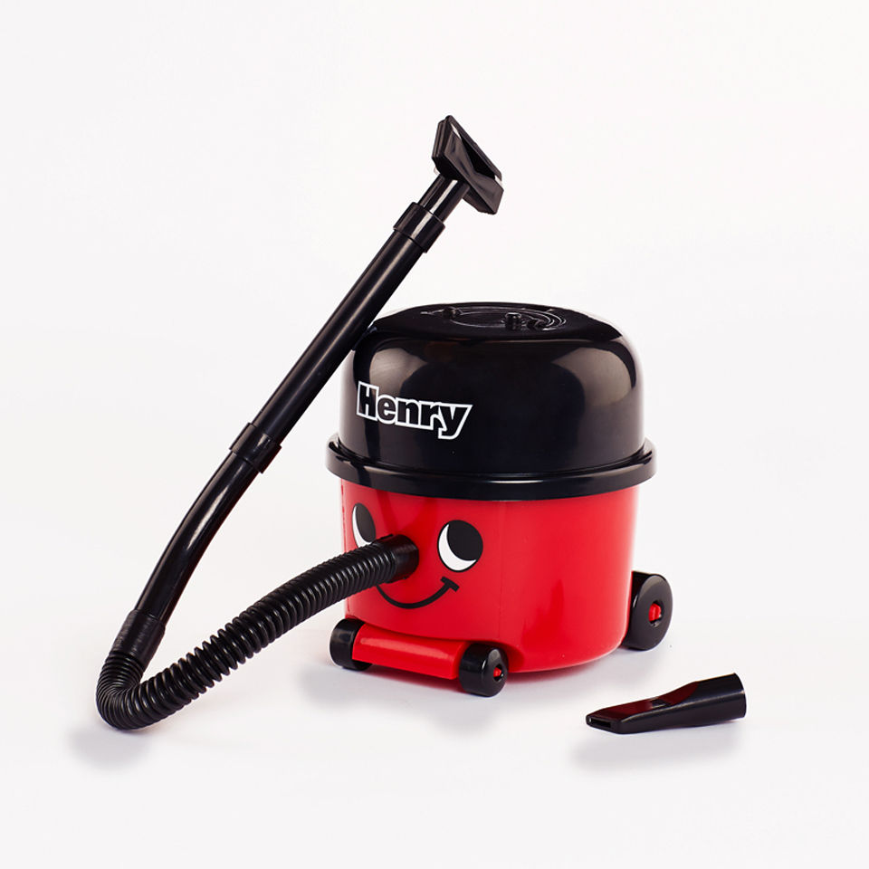 Image of a mini Henry Hoover with its extra hose nozzle placed next to it