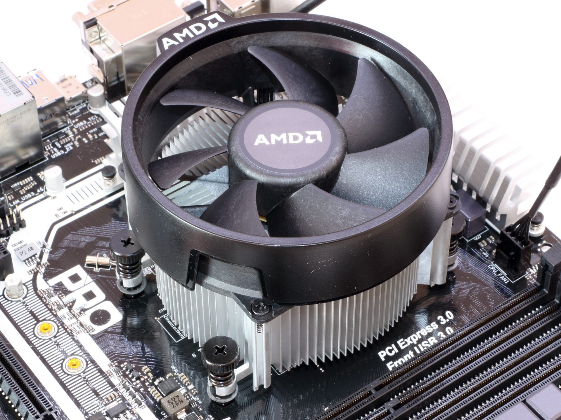 Close up image of an AMD Wraith cooler attached to a motherboard