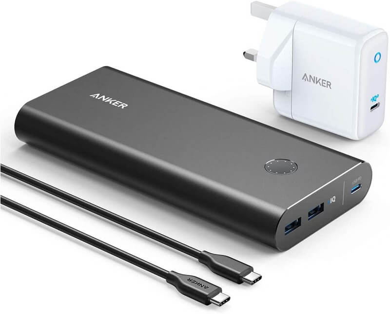 Anker Power Bank PowerCore+ next to a power cable and mains plug, can be used to charge a Steam Deck