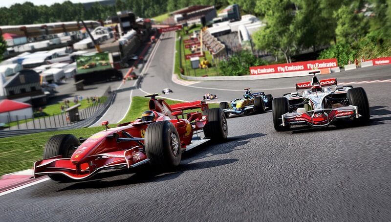 Promo image of the game F1 2017 showing 3 formula 1 cars racing on a track