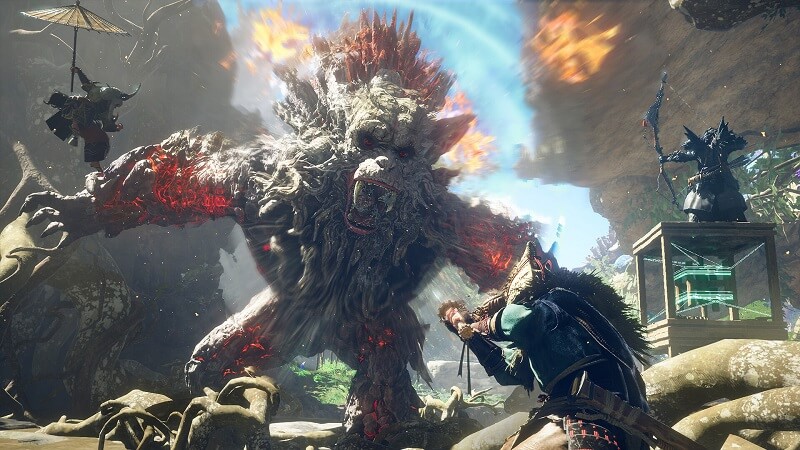Gameplay capture image from Wild Hearts showing 3 characters facing off against a giant ape-like creature