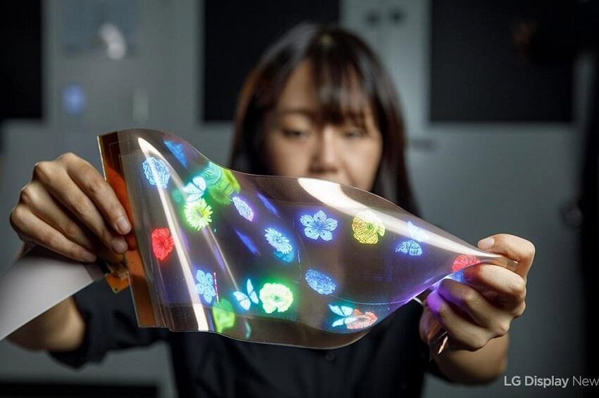 Image of a woman showcasing the LG flexible screens