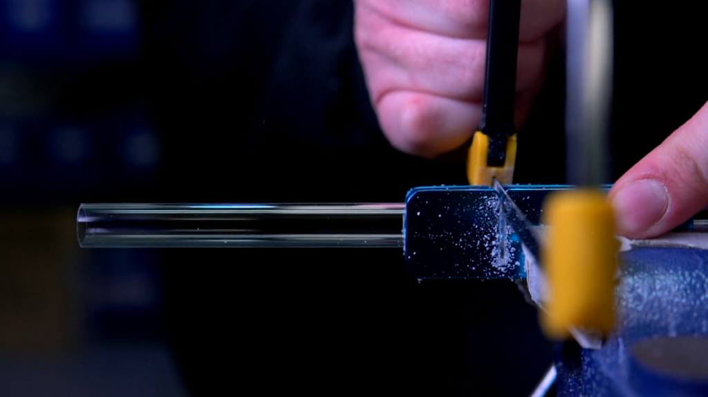 Close up of a piece of waterloop tubing being cut