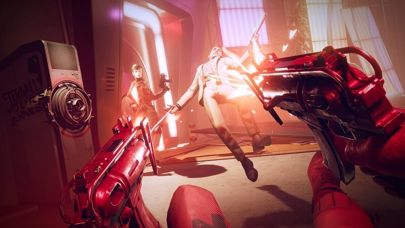 Screen capture image from the game Deathloop showing dual-wield guns firing at an enemy